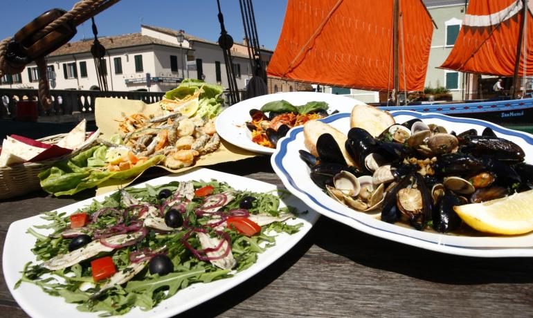 Fresh seafood dishes in a picturesque maritime setting.